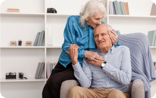 elderly couple embracing
